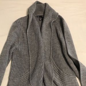 Gray cardigan sits just below the waist.  Looks nice with jeans or trousers.